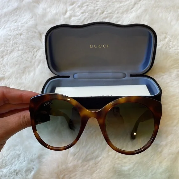 Gucci GG0028 Sunglasses feature an oversized cat-eye shape for women in brown. - Picture 9 of 11